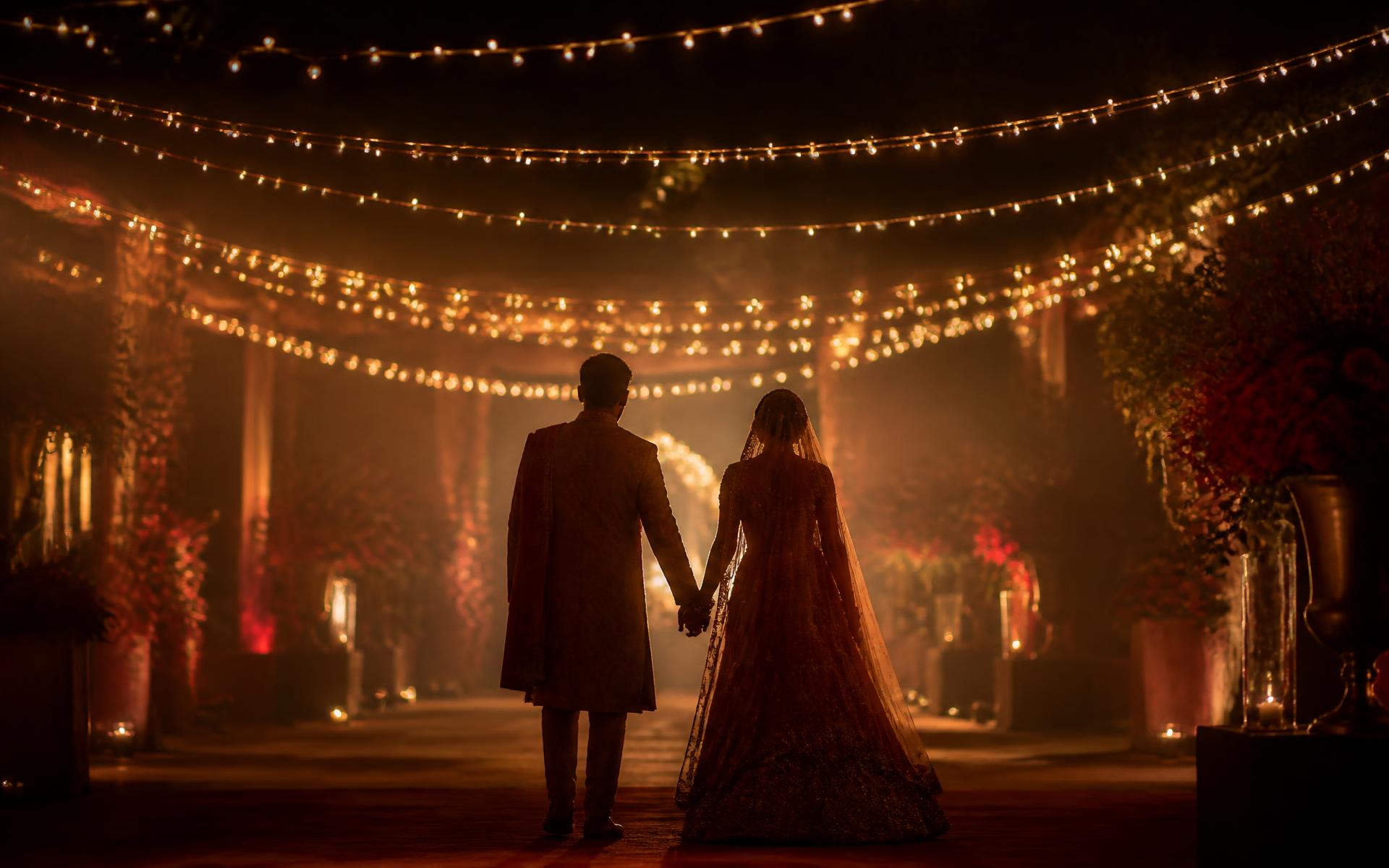 Aarav and Ishani walking beneath fairy lights